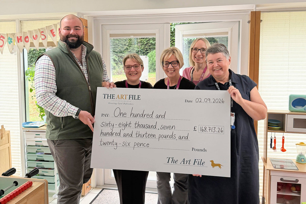 The Art File and Young Lives vs Cancer team pose together with a cheque for £150,000.