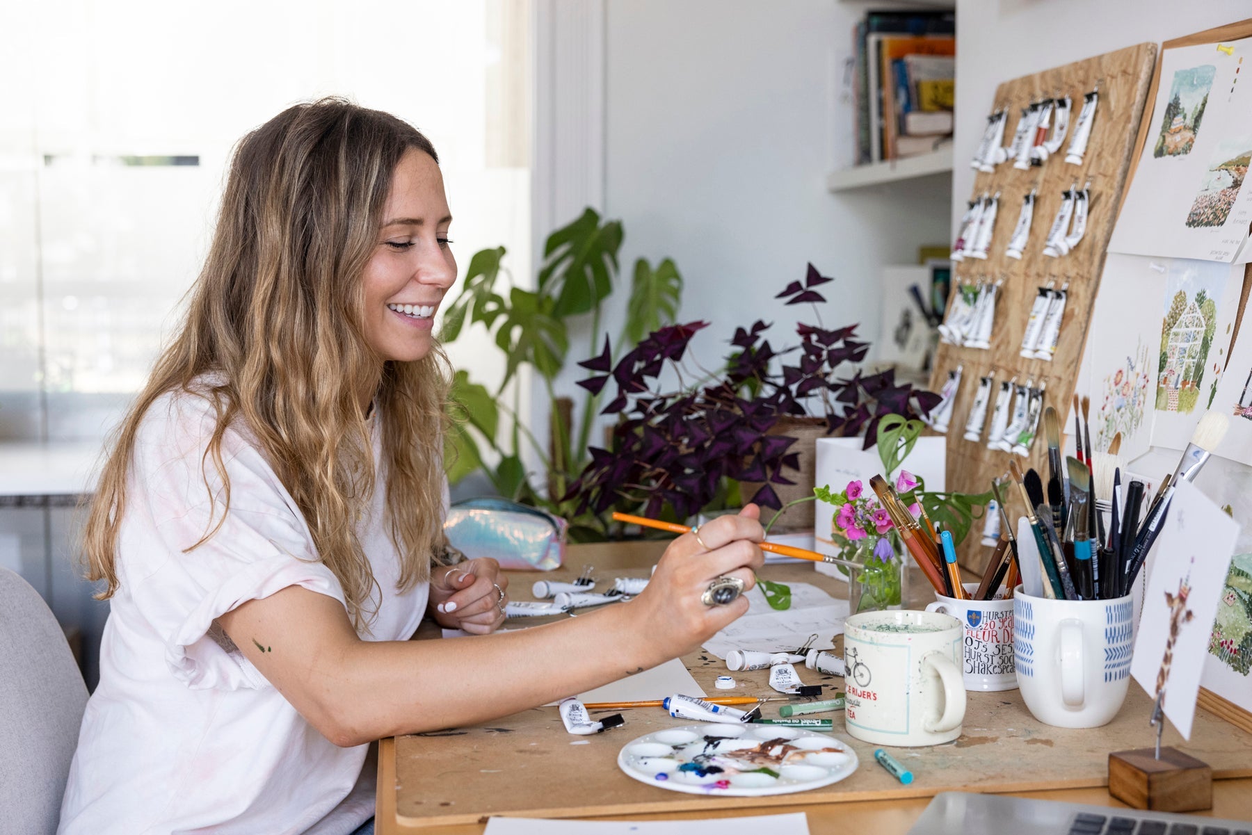 Louise Mulgrew at her desk in her studio
