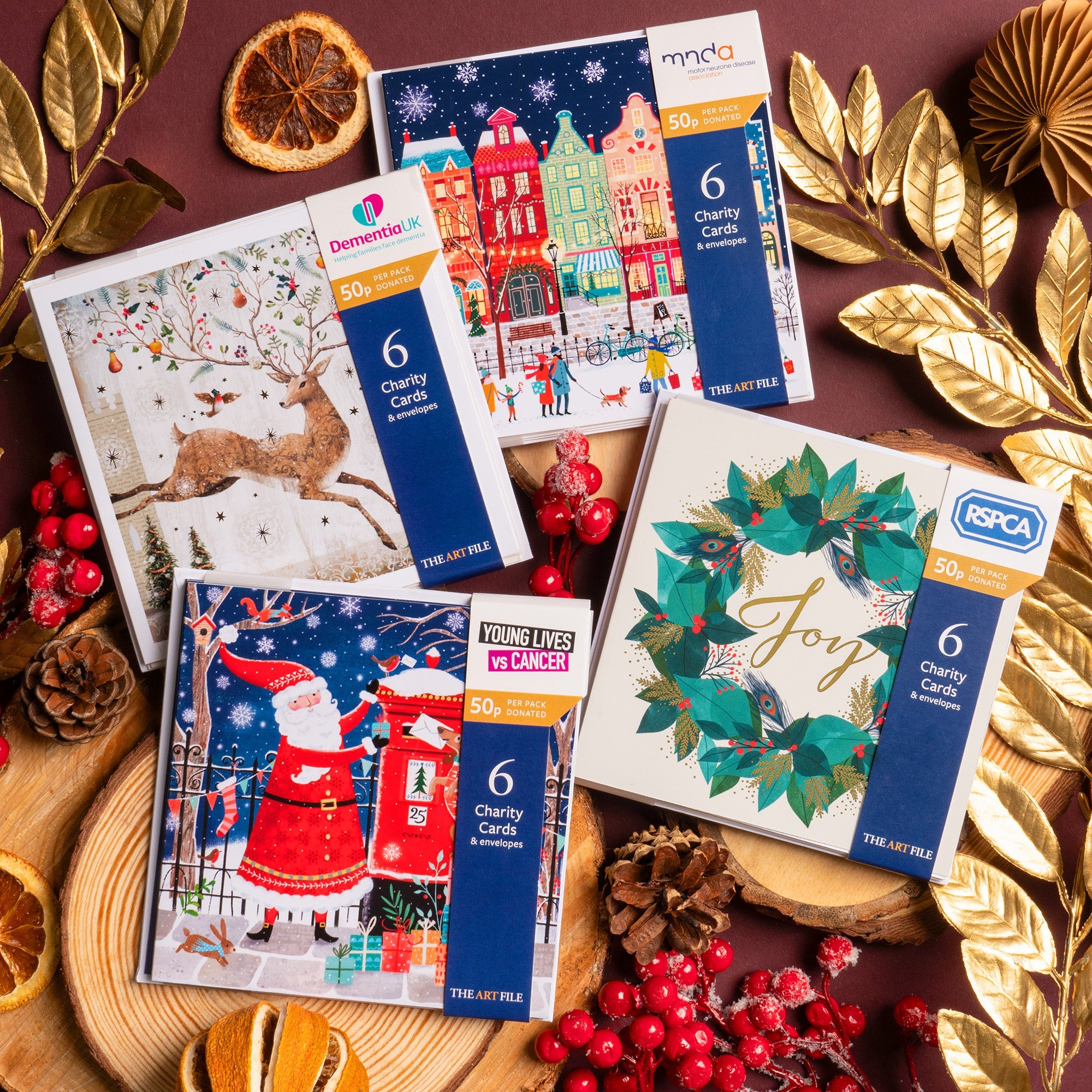 Christmas charity packs laid out with festive decorations.