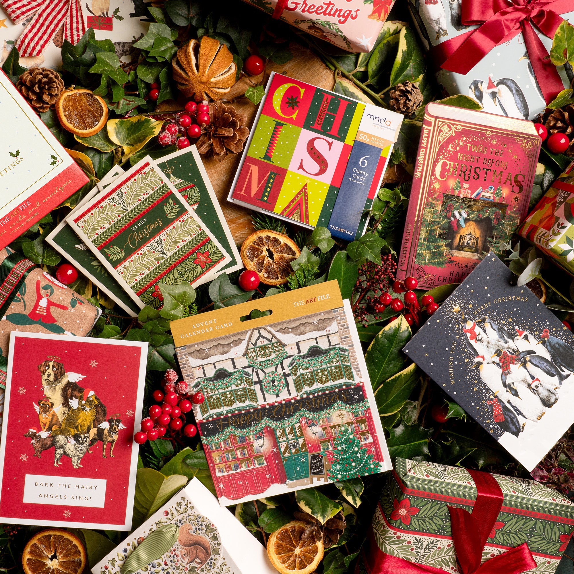 Christmas cards and presents displayed together amongst festive decorations.