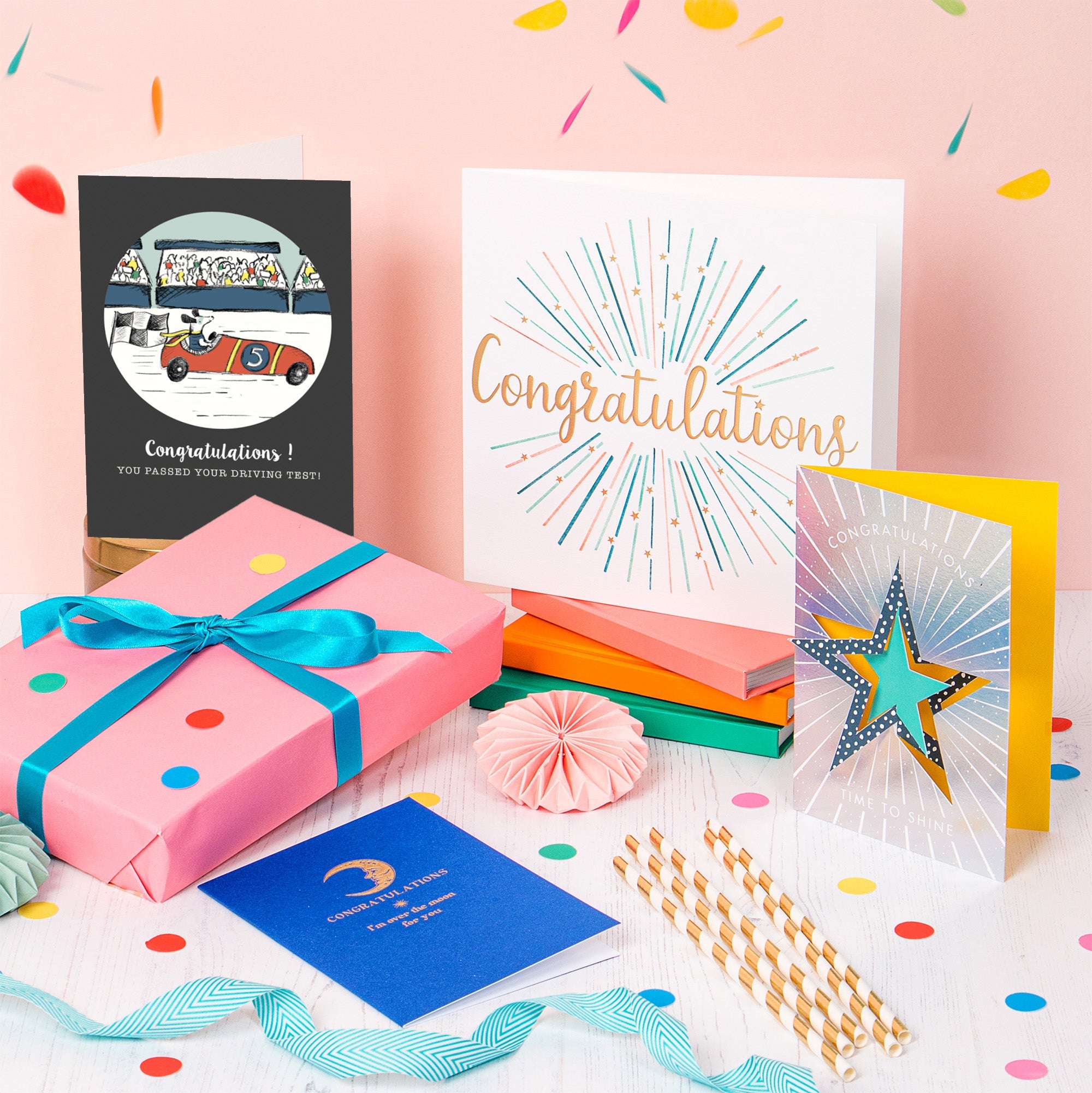 Congratulations cards out on display including a wrapped presents and a driving congratulations card.