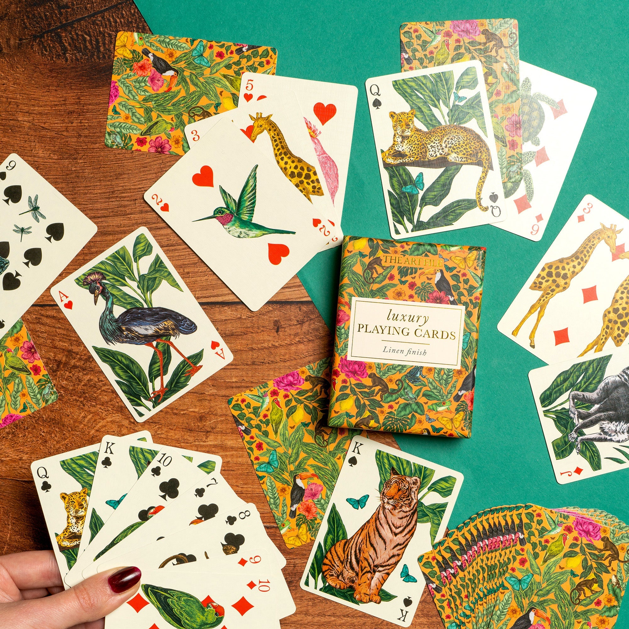 A deck of playing cards is displayed on a table.