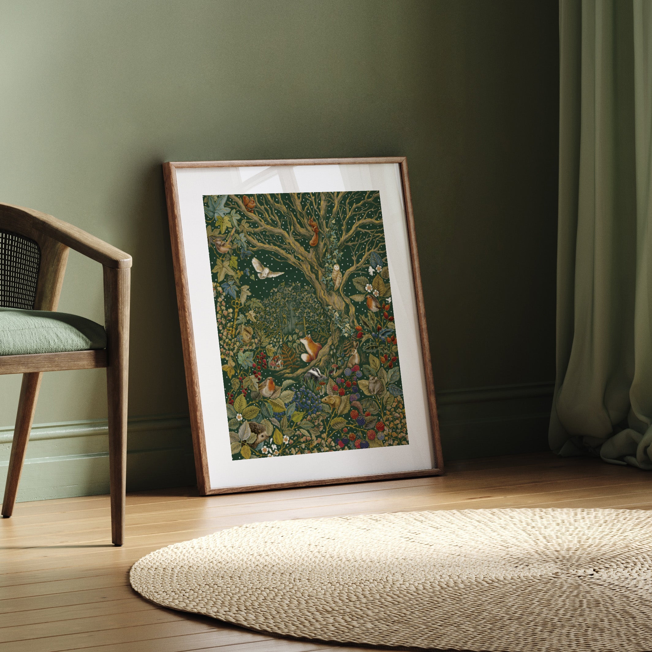 Framed artwork on a wooden floor with a chair and rug in the background