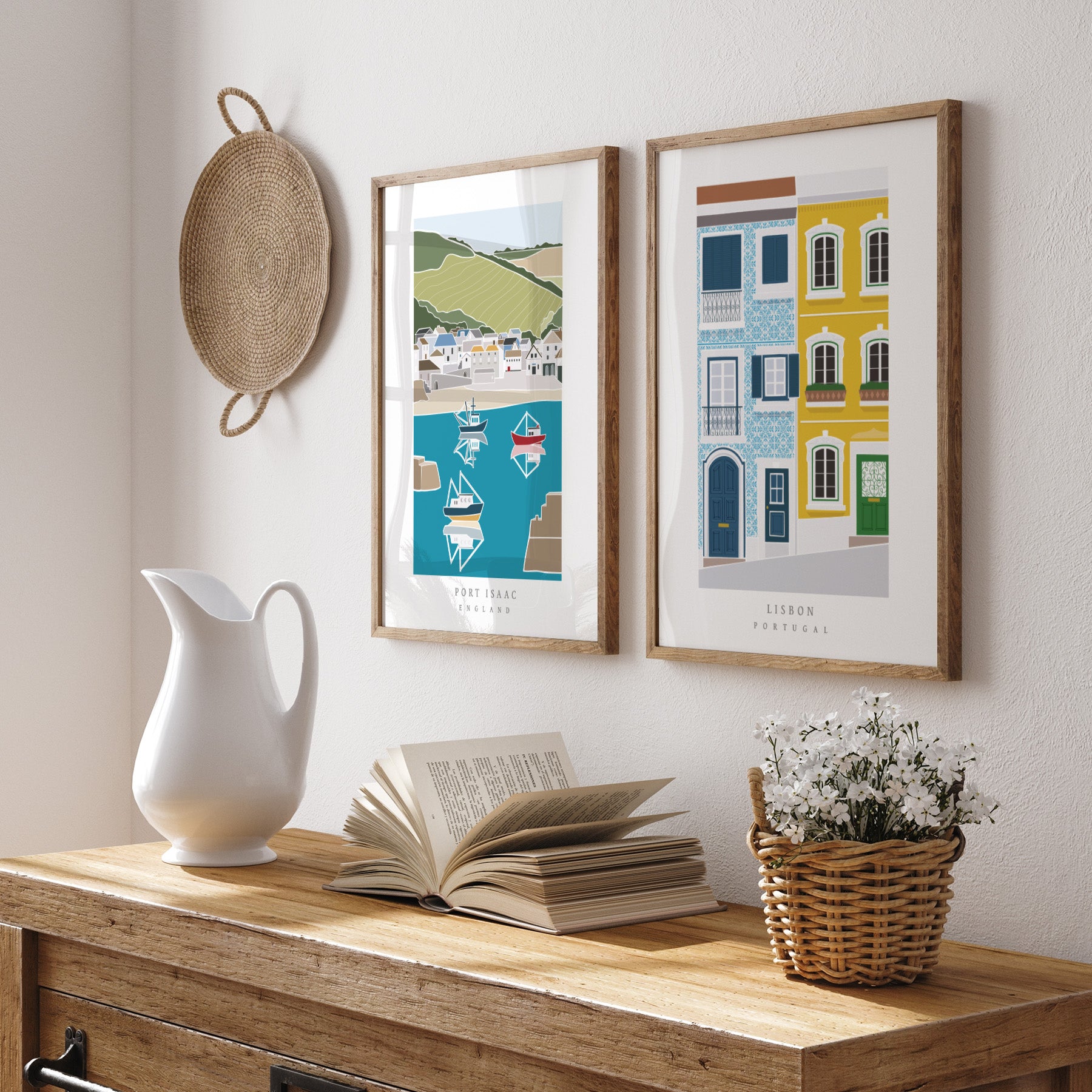 Framed artworks on a wall above a wooden console table with decorative items.