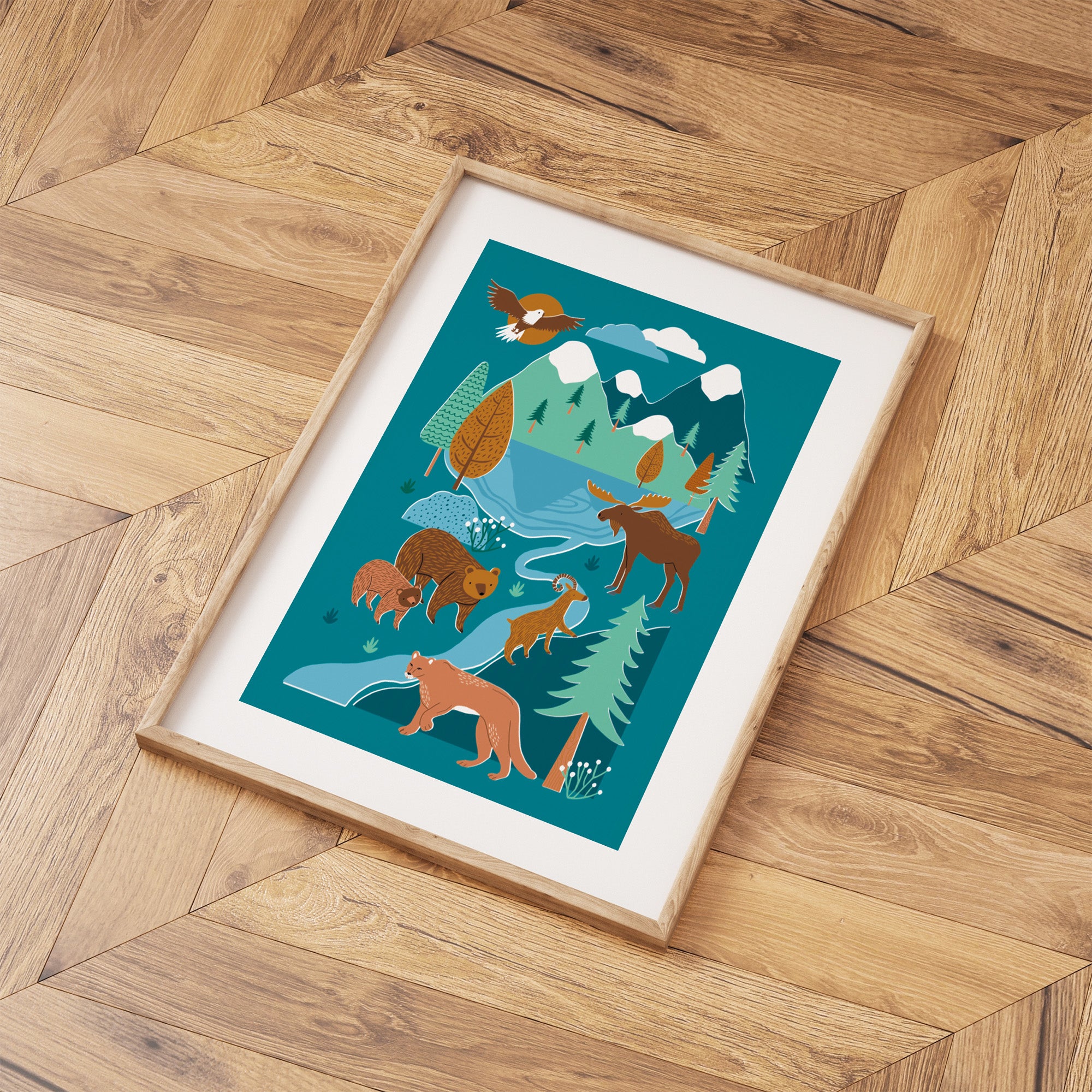 Framed illustration of animals in a forest on a wooden floor.