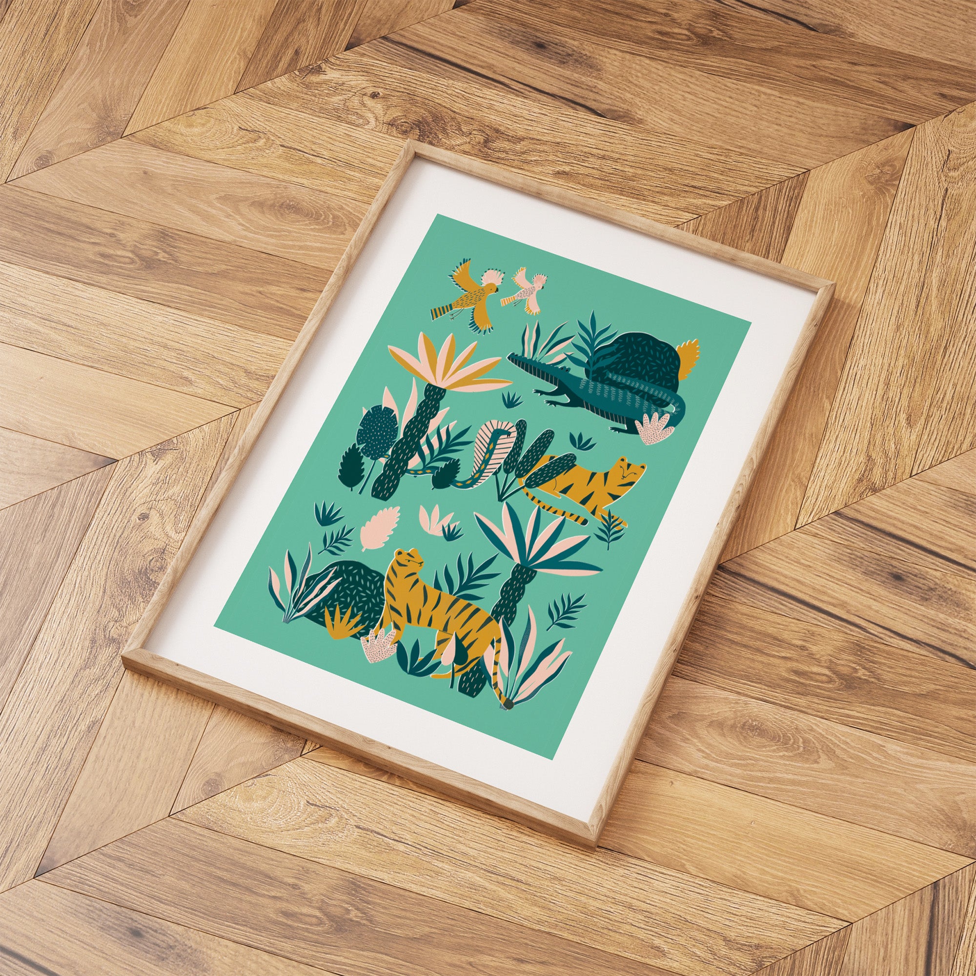 Framed artwork with a colourful animal and plant design on a wooden floor.