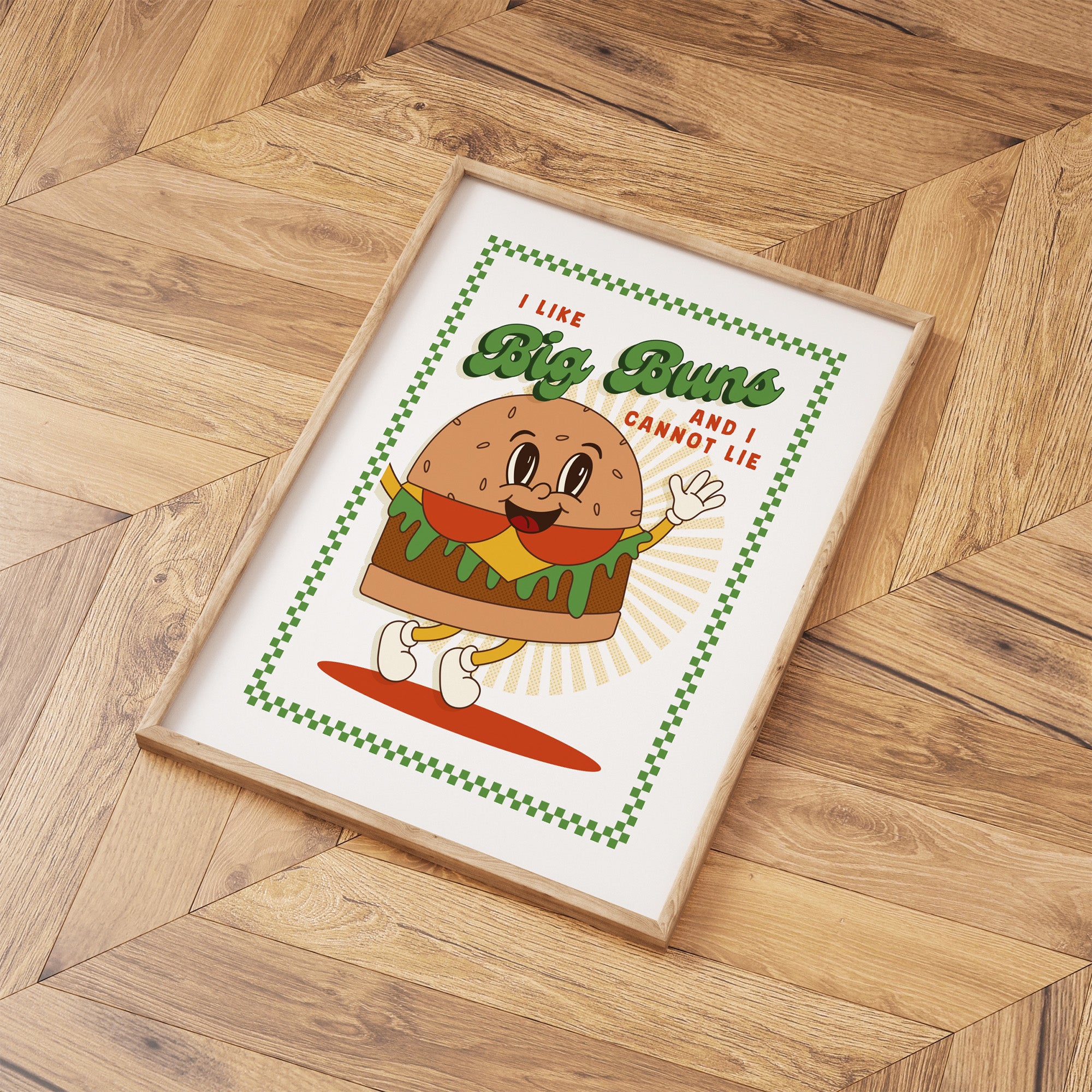Framed poster with a cartoon hamburger character on a wooden floor.
