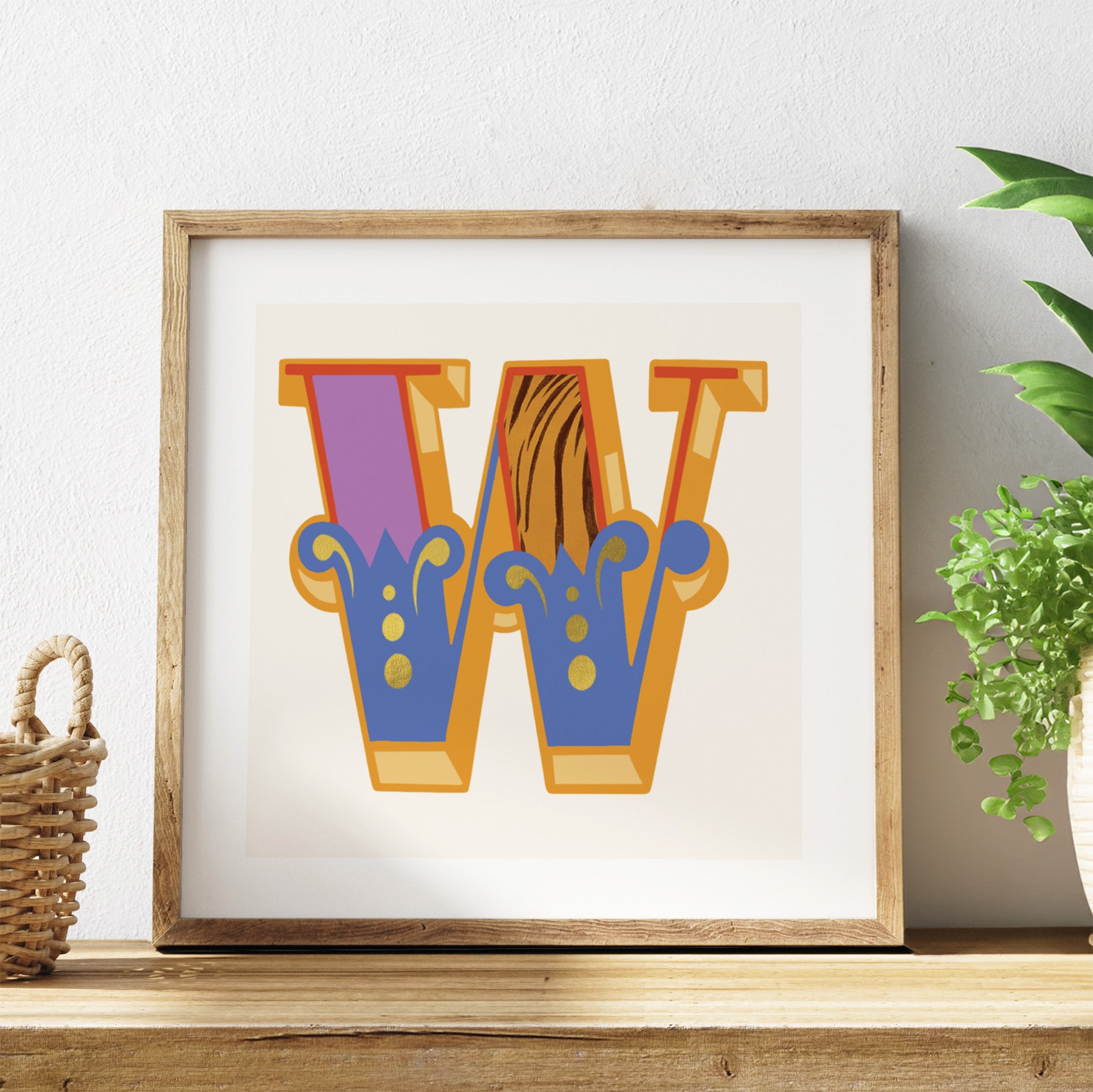 Framed artwork with colourful letter 'W' on a white background.