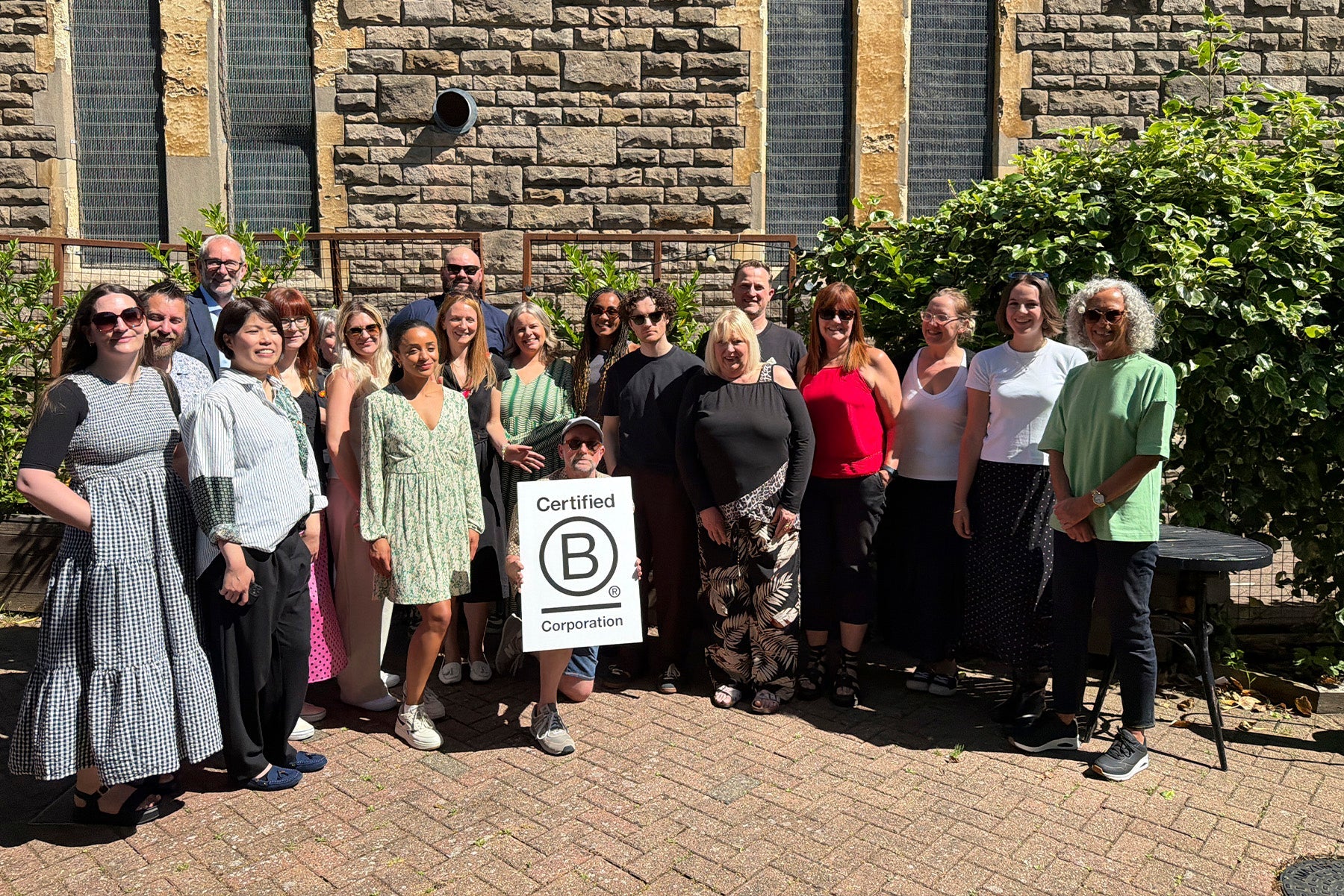 The Art File team celebrating B Corp together in a photo.