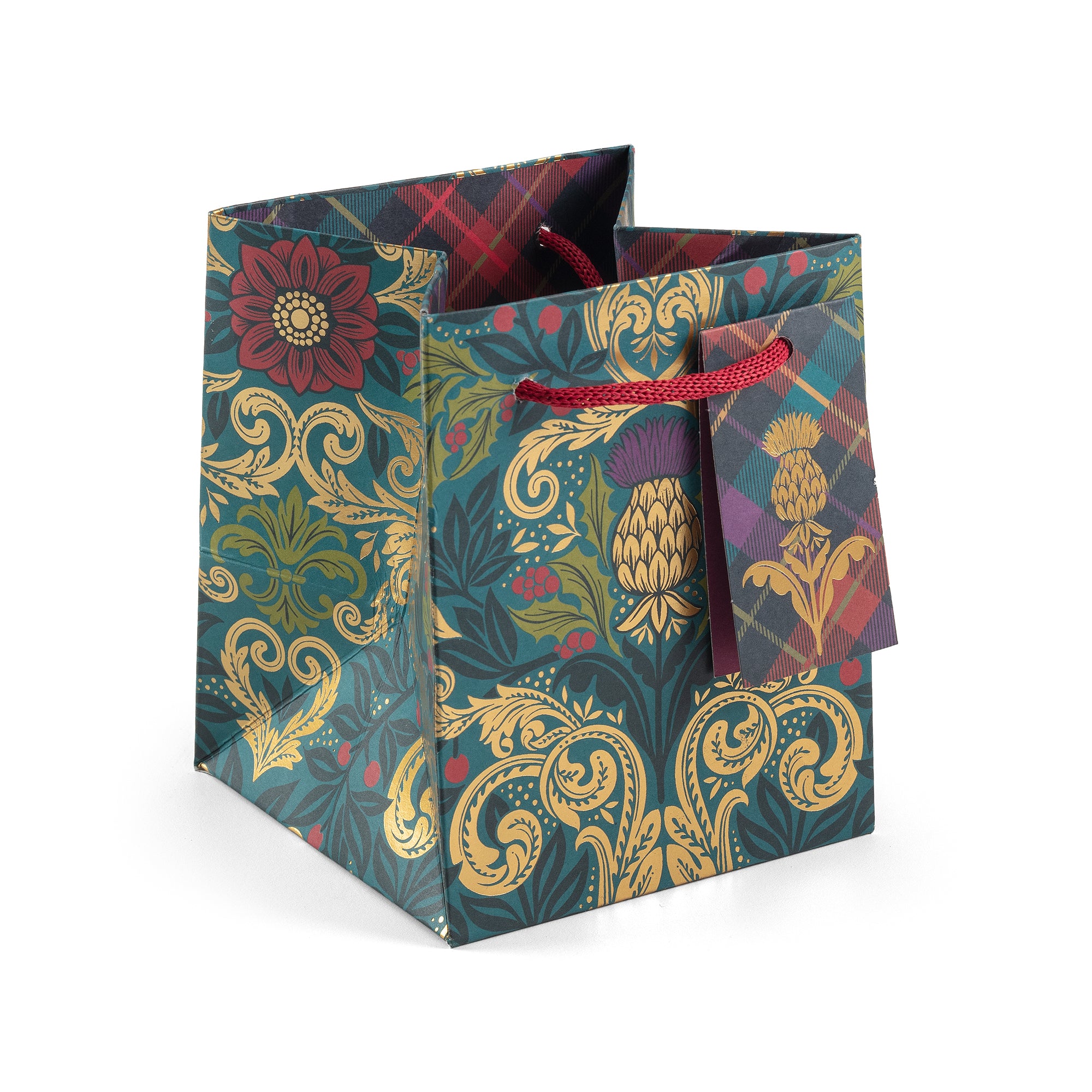 Decorative gift bag with floral and paisley patterns on a white background