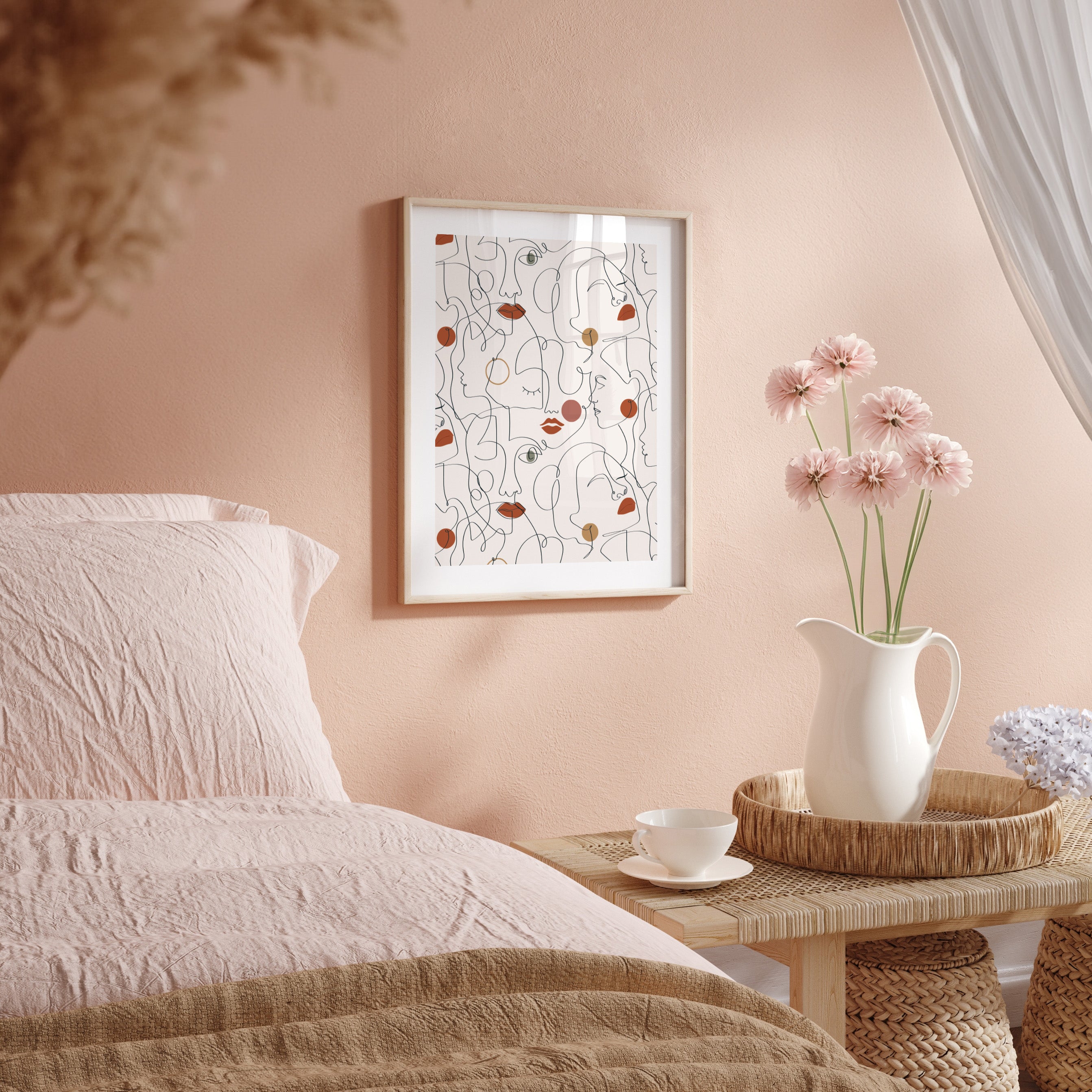 Neatly made bed with a side table featuring a vase of flowers and a framed abstract art piece on a pink wall.