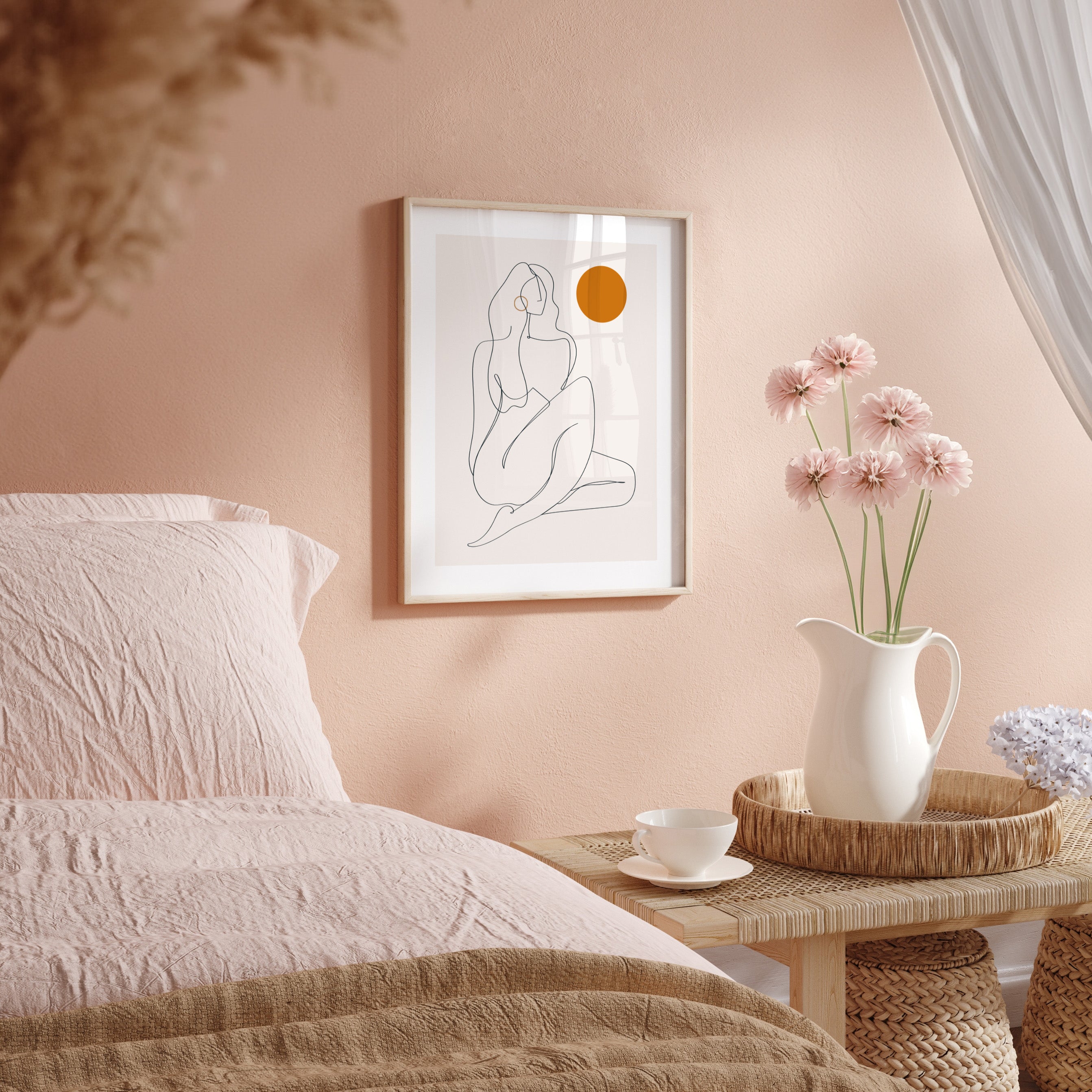 Bedroom interior with a framed artwork, flowers in a vase, and a cup on a side table.