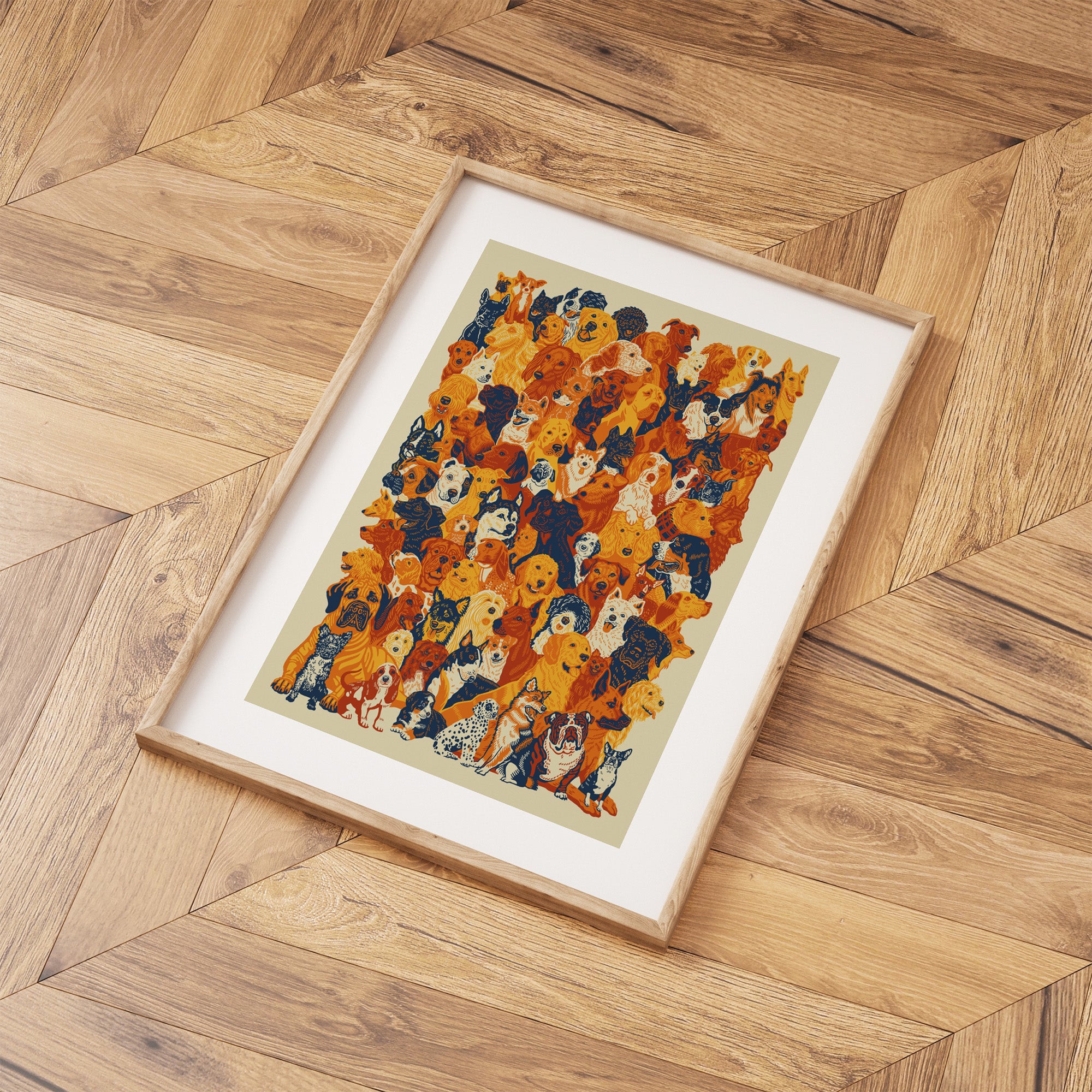 Framed art print containing an Illustration of 93 dogs in orange, black and white. Print is laid out on a wooden floor.