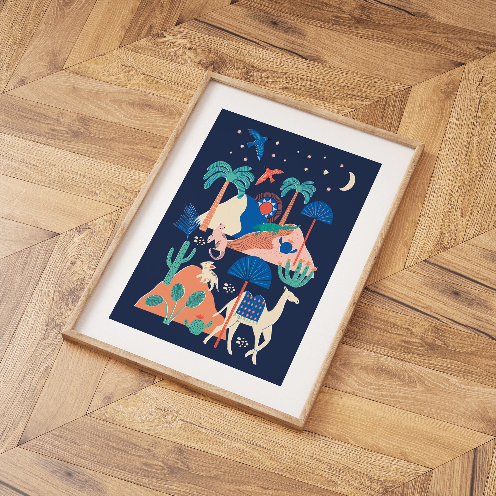 Framed artwork with a coluorful design of animals and plants on a wooden floor.