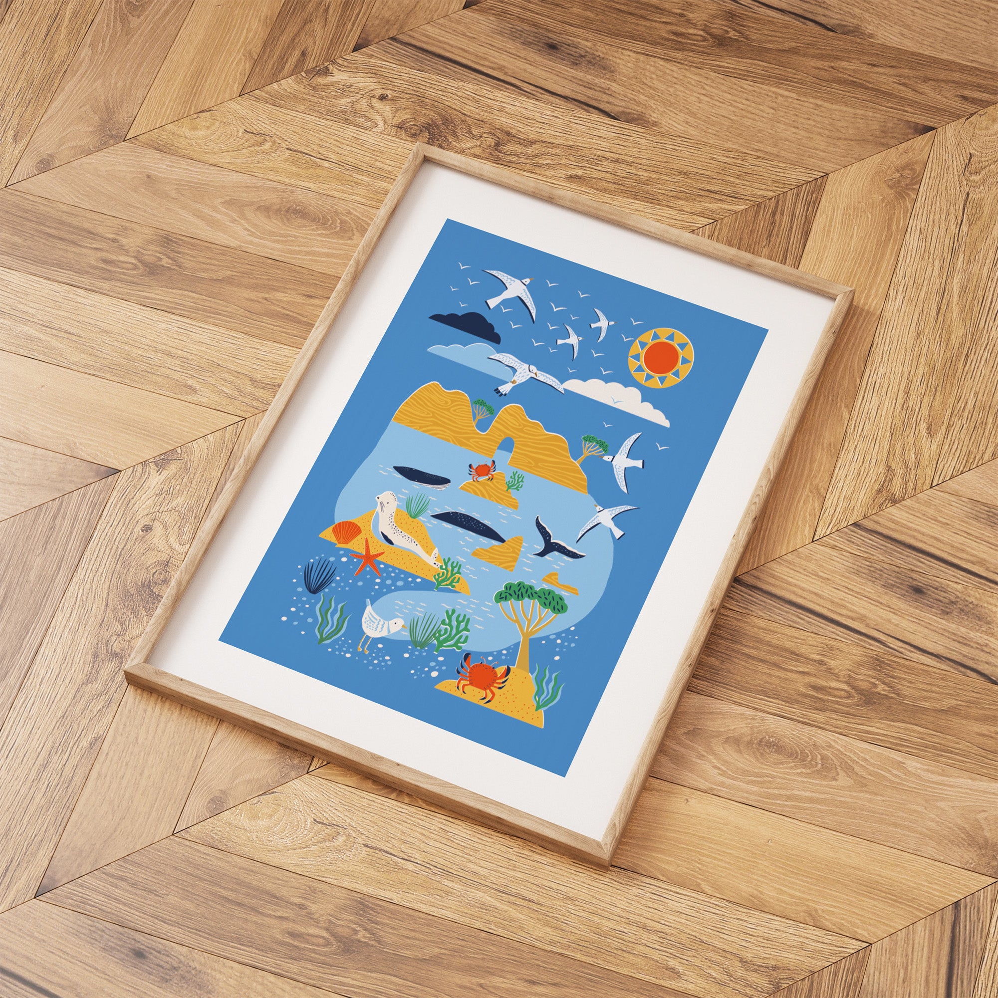 Framed illustration of a desert scene with animals on a wooden floor.