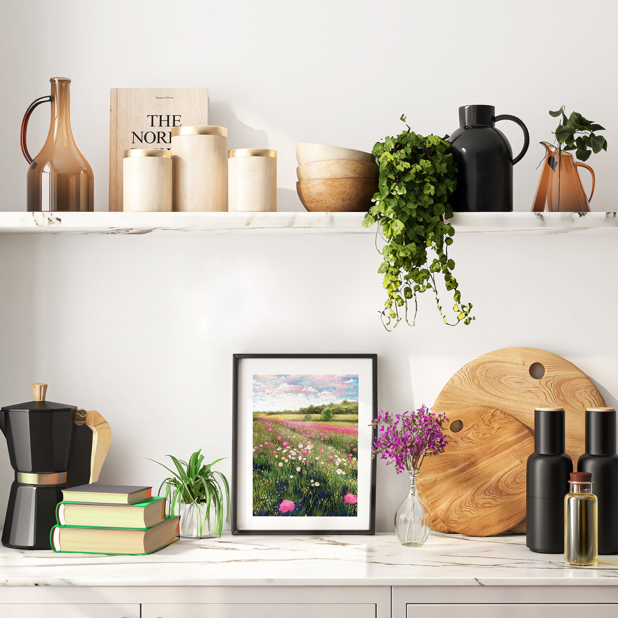 An art print that features a sunny field of flowers in the countryside. The print is framed and displayed in a kitchen.