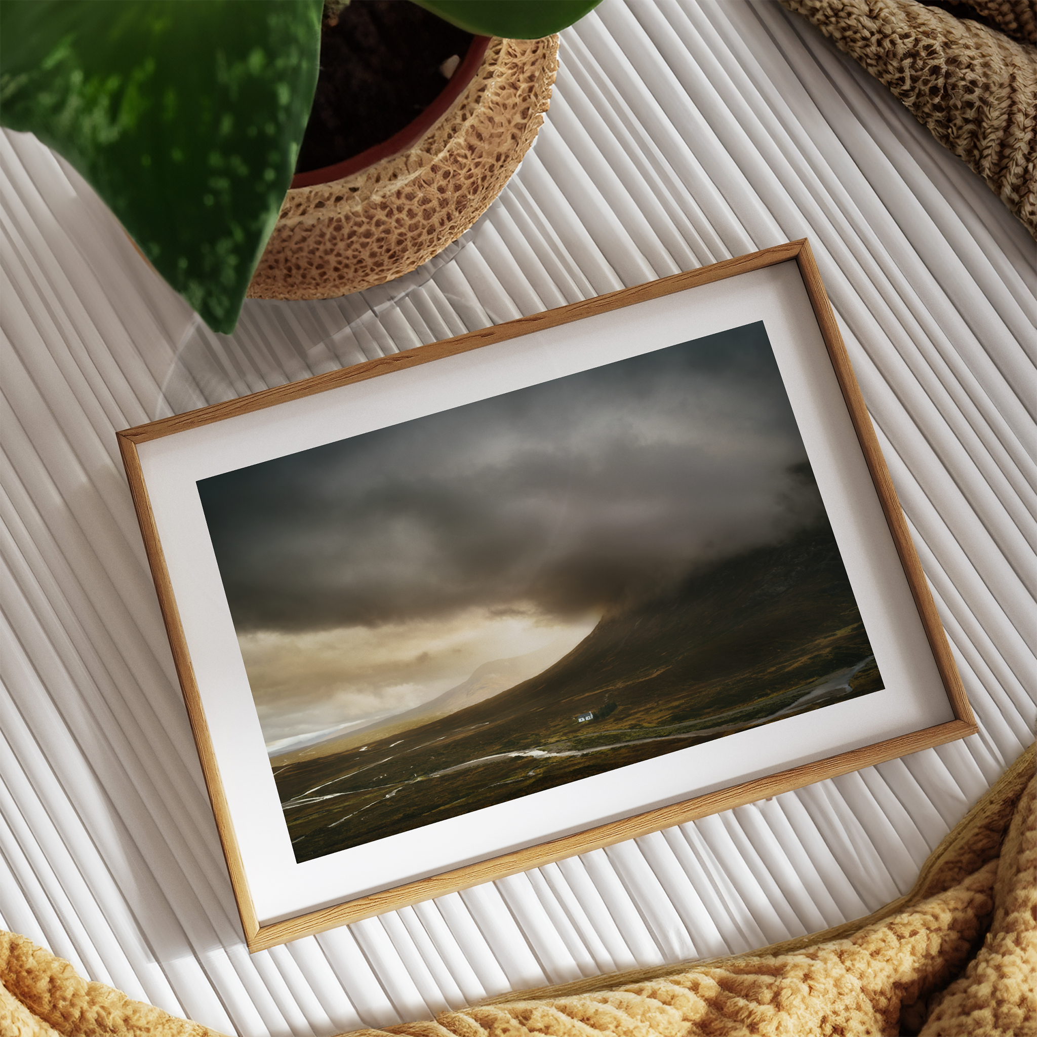 Framed photography artwork of a landscape with stormy skies on a textured surface.
